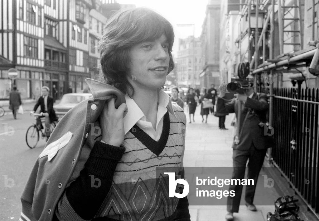 Rolling Stone: Mick Jagger attending court where Keith Richard & Anita Pallenberg at Marlborough Street Magistrates Court, London. Keith pleaded guilty to possessing a .38 revolver, 100 rounds of .22 ammunition & a 9mm shotgun, without firearms certificates. He also admitted charges of possessing Chinese heroin, cannabis, 3 Physeptone tablets & a Mandrax tablet. He was fined £125 on the firearm charges & £80 on the drugs charges. Anita pleaded guilty to illegal possession of 25Mandrax tablets, she was conditionally discharged for a year. 24 October 1973 (b/w photo)
