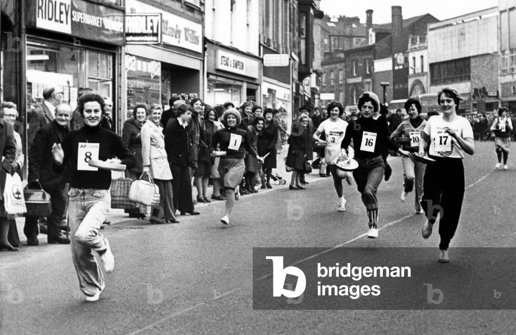 Pauline Barwick storms to victory in the Carlisle Shrove Tuesday Pancake race 22 February 1977