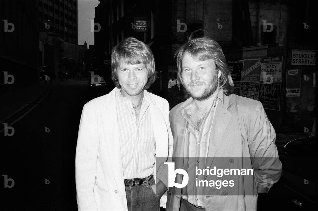 Bjrn Ulvaeus and Benny Andersson of Swedish pop group ABBA leave their Drury Lane hotel in London to see Pink Floyd performing at Earls Court. 8th August 1980 (b/w photo)