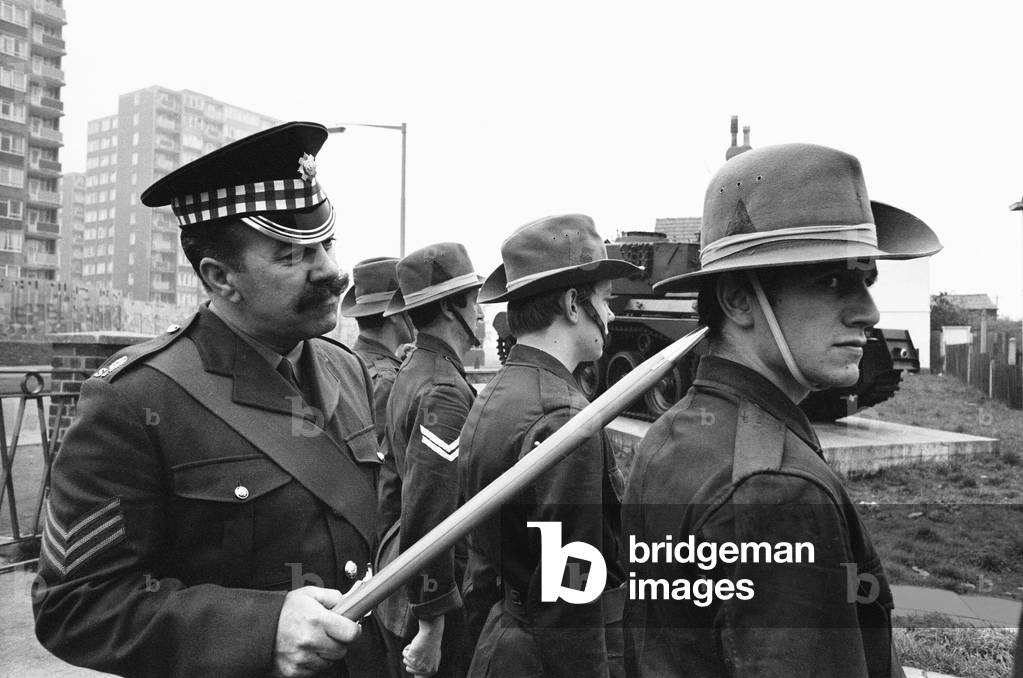 Sergeant Bill Davies of the Scots Guard, drills Brian Miller, William Ellis, Graham Corry, Stephen Berkoff, Warren Clarke, Tony Colegate and William Kendrick, members of the Liverpool Playhouse cast for their roles in 