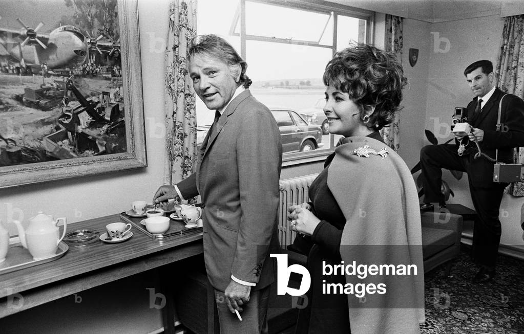 Richard Burton & Elizabeth Taylor after arriving by private jet at RAF Abingdon, Oxfordshire, 13th October 1967.