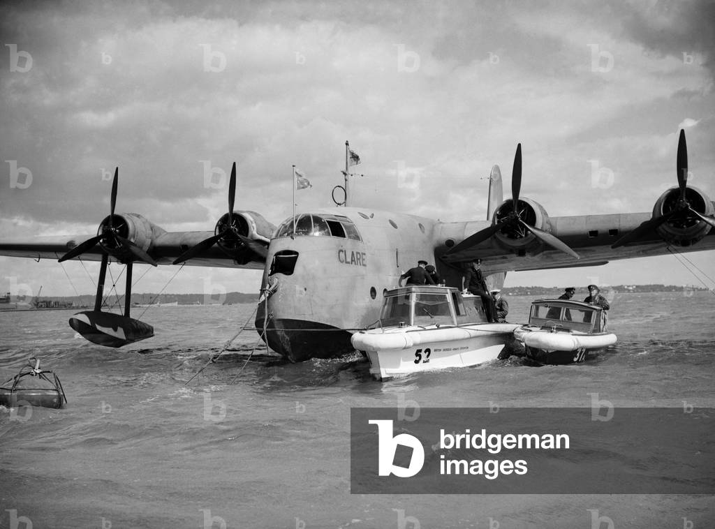 Shorts S30 Empire Flying Boat G-AFCZ named Clare owned and operated by BOAC. Seen here at Poole in Dorset following its trans-Atlantic flight, 10th August 1940 (b/w photo)