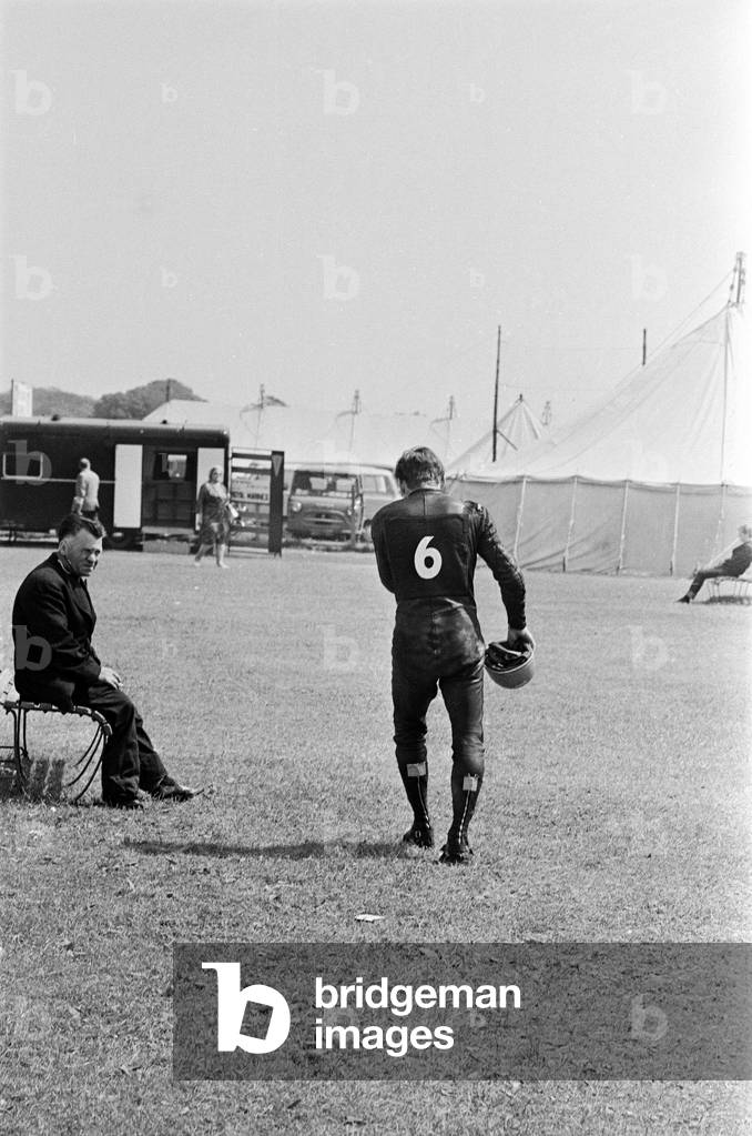 Isle of Man TT Races -Junior 125cc Event. Bill Ivy walks away after his Yamaha only lasted one lap. 13th June 1967 (b/w photo)