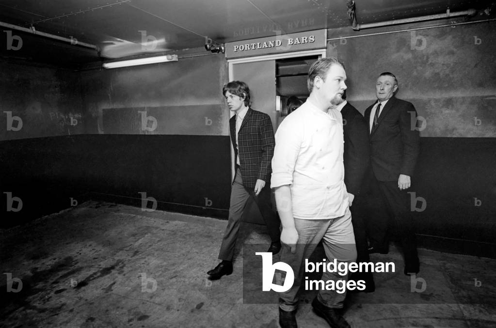 Mick Jagger of the The Rolling Stones leaving their hotel to go to the Odeon Cinema in Manchester 3 October 1965 for their two shows.