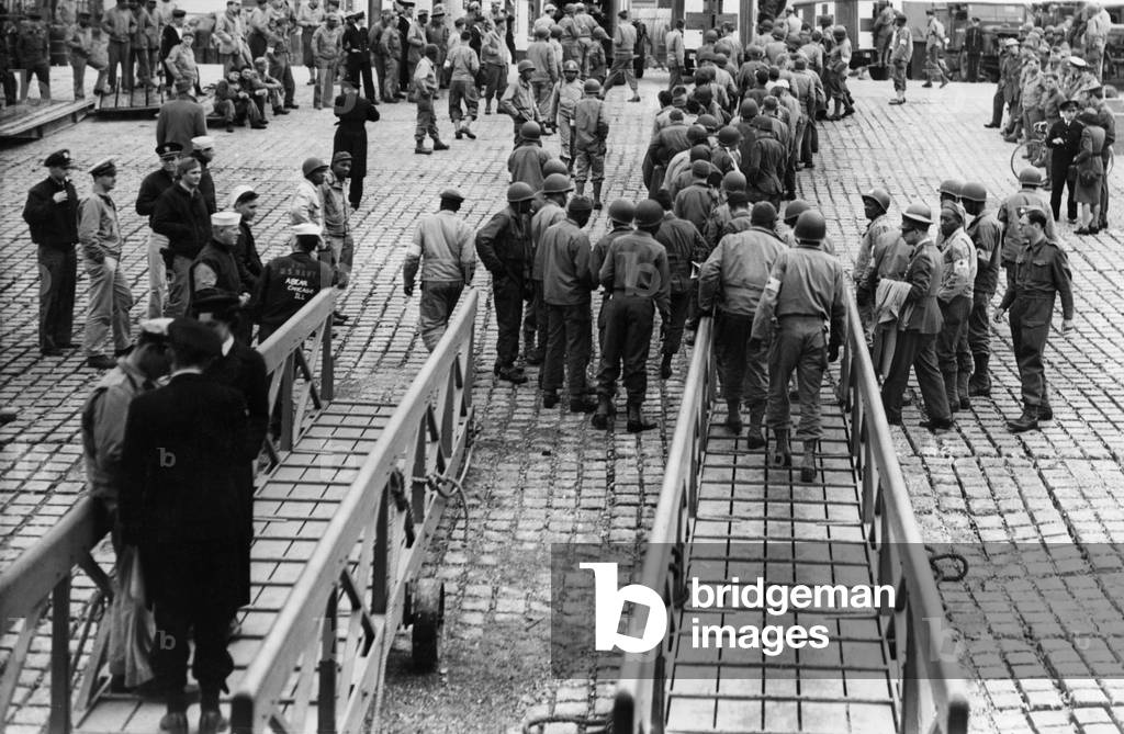 American wounded from the Normandy beach heads seen here arriving at a undisclosed British port on the South Coast 9th June 1944 (b/w photo)