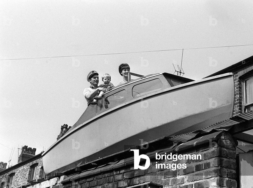 Boat on roof for Worthington Family, April 1968 (b/w photo)