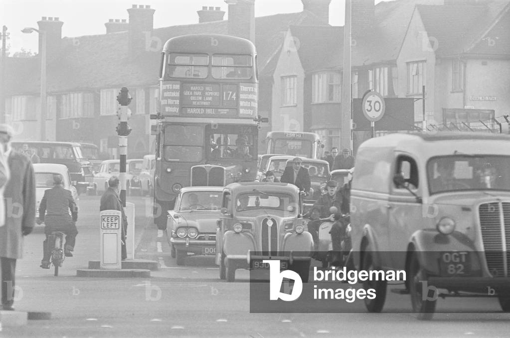 Traffic in High Street Dagenham as the Ford factory turns out at the end of the day shift. 2nd October 1963 (b/w photo)