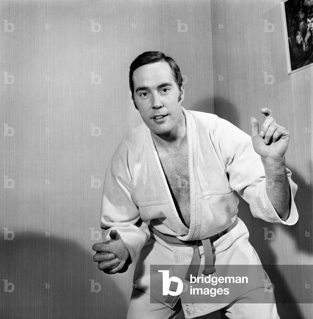 Sport Judo: Man posing wearing his judo pit. November 1969