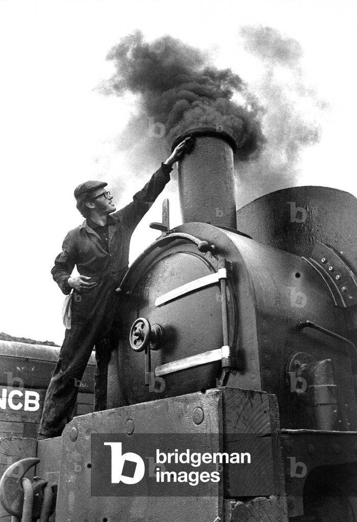 An Engineer giving his steam locomotive a last clean before going on show to the public on 28th May 1973 (b/w photo)