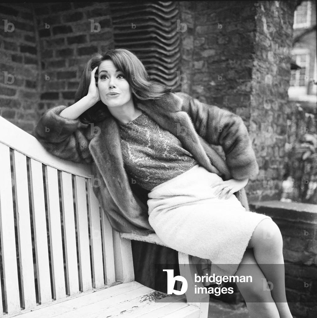 Parisienne actress Claudine Auger who will play Domino in the James Bond film Thunderball, seen here during an interview with the Daily Mirror show business reporter Donald Zec. 17th February 1965 (b/w photo)