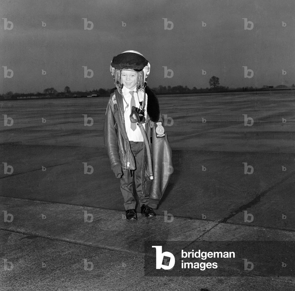The First Royal Phantom Training Unit will be commissioned at the Royal Training Air Station in Yeovilton, Somerset. Lieutenant Commander Peter Marshall has been chosen to lead the training of the pilots and observers who will fly the fighter version of the aircraft. Pictured is his four year old son Richard trying out dad's outfit. 13th January 1969 (b/w photo)