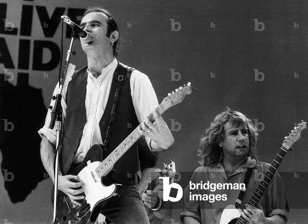 Francis Rossi lead singer with Pop Group Status Quo singing on stage at Live Aid concert