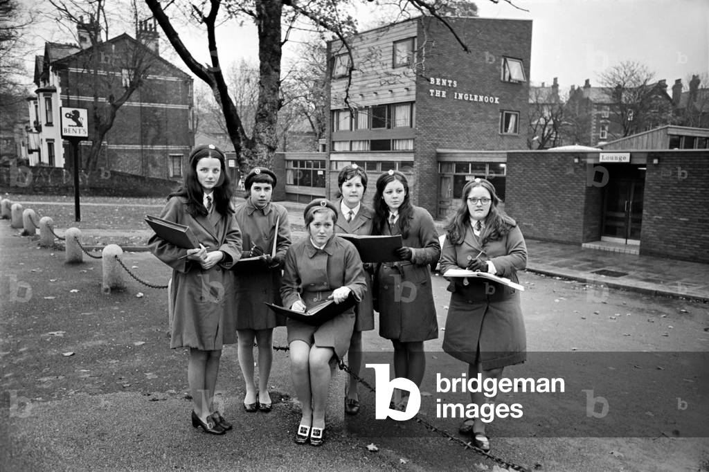 School girls near Liverpool's Sefton Park out on an urban trip as part of their geography lesson, undertaking a survey. November 1969