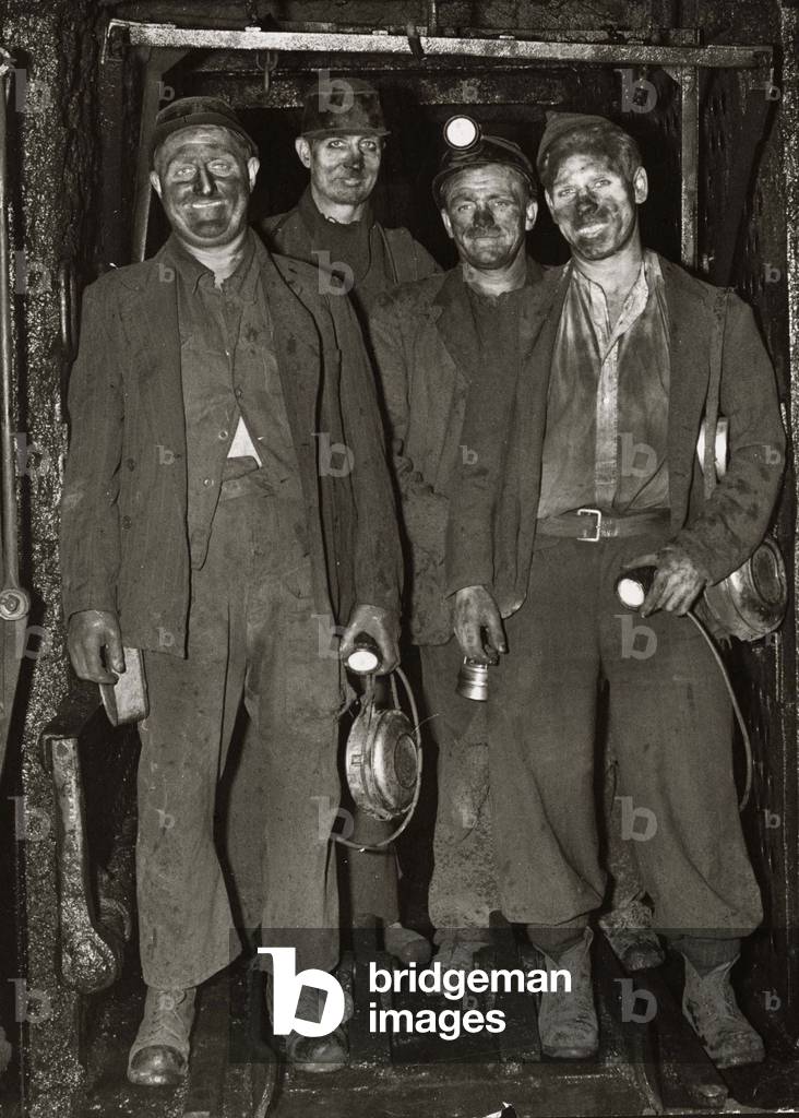 Coal Miners return to the surface after a hard day digging for coal in the mines April 1951 (b/w photo)