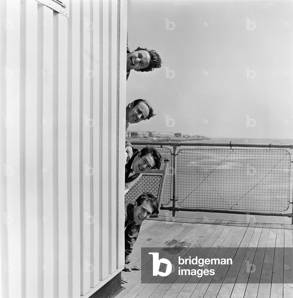 Liverpudlian pop group Gerry and the Pacemakers led by Geery Marsden pose for the camera at the back of the Rainbow Theatre in Blackpool. 2nd July 1965 (b/w photo)