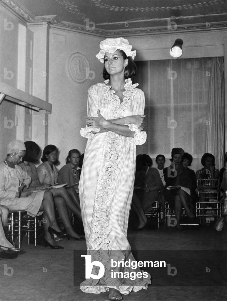 Fashion 1960s. The moll flanders look. All demure and frilled up to the eyebrows. That's the new look for bedtime as seen at the Angela Gore show of nightwear in Mayfair yesterday (15-9-64). 
