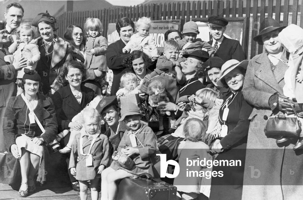 The Right Spirit - This was a really happy party of Percy Main mothers and young children 'snapped' while waiting for the evacuation train at the station today. 7th September 1939