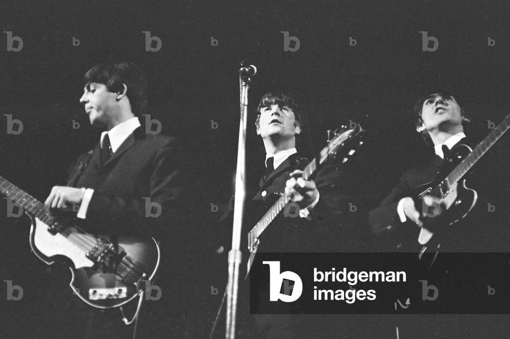 Beatles seen here performing on stage November 1964 (b/w photo)