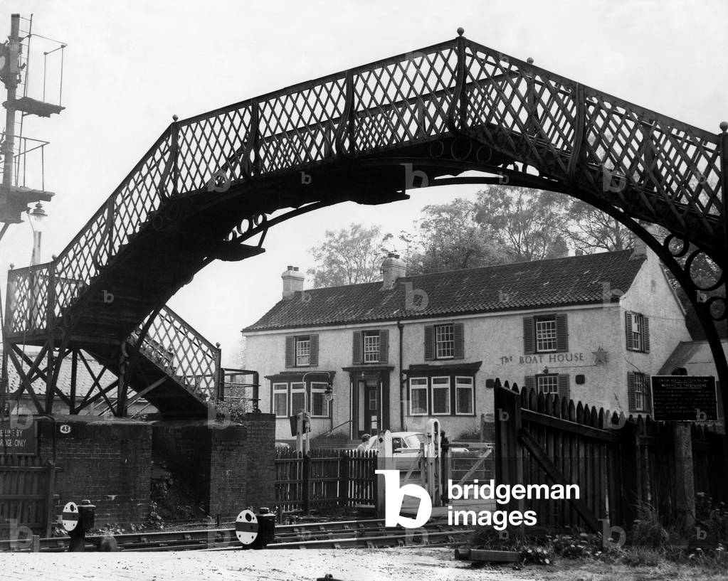 A general view of The Boat House pub and footbridge from the platform of Wylam Railway Station on 14th May 1969 (b/w photo)