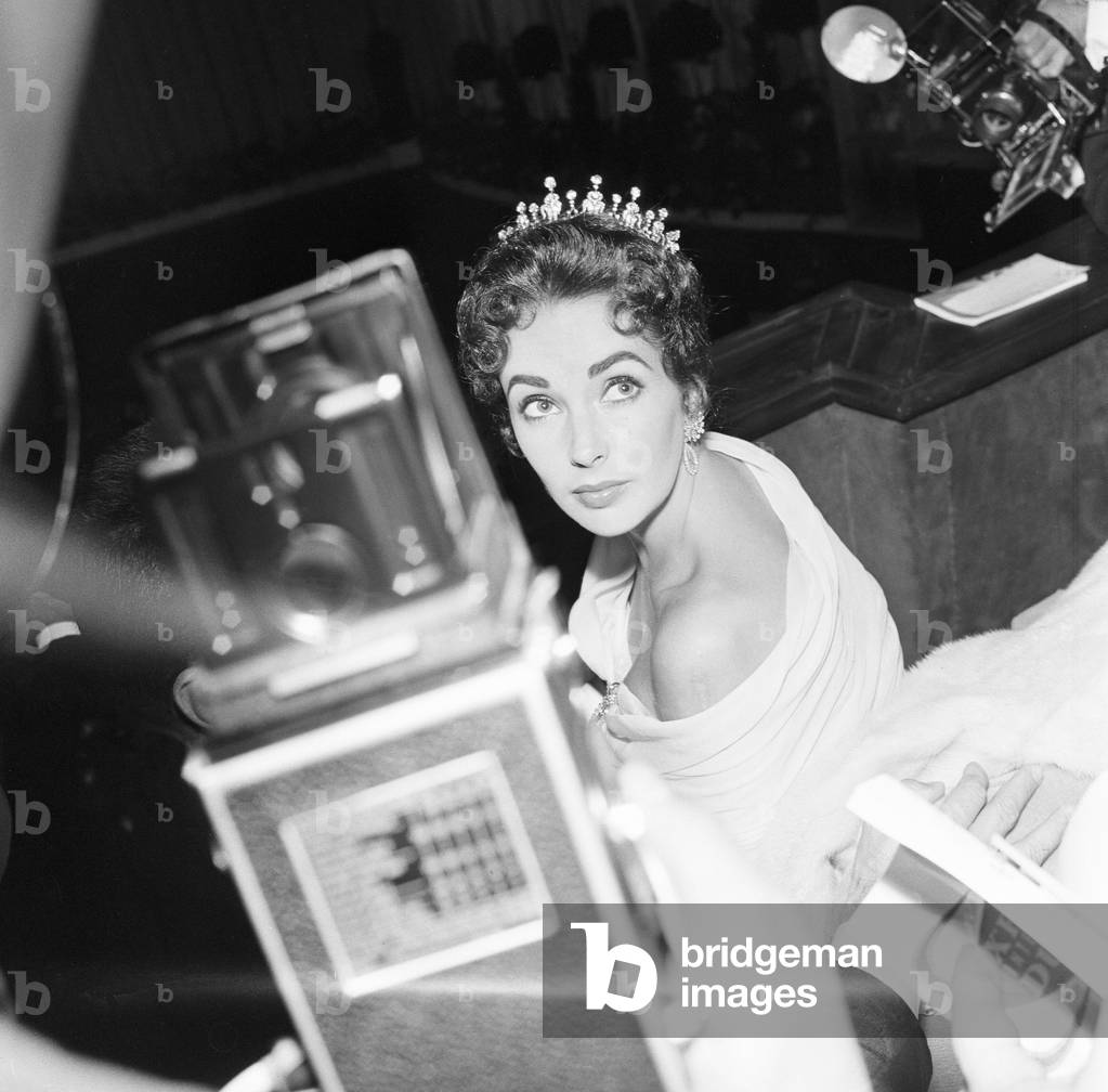 Elizabeth Taylor pictured on opening night of the Cannes Film Festival 1957, where her husband and film producer Mike Todd, is promoting new film Around the World in 80 Days. Cannes, France, 6th May 1957.