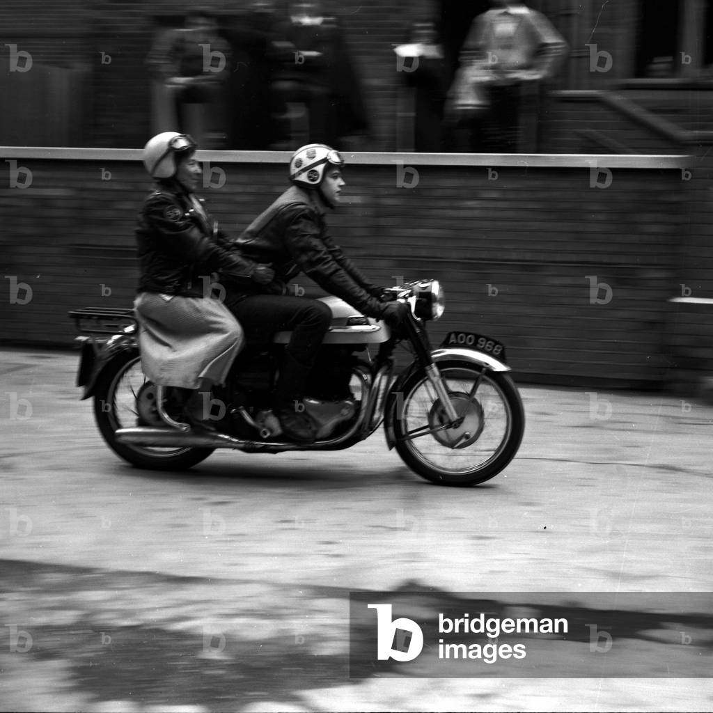 With her crash helmet on fair and square, and goggles flipped back, 80 year old 