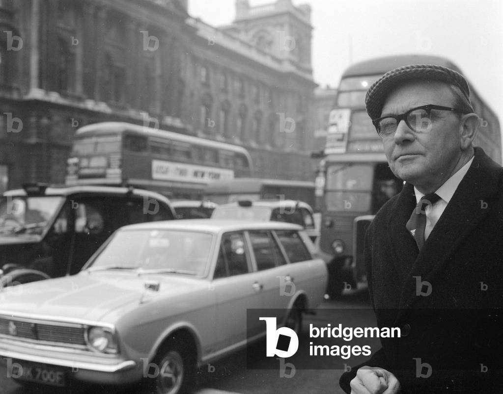 Mr Jack Jones of the Transport and General Workers Union wearing a cloth cap which is well known for wearing in cold or wet weather, 10th December 1968 (b/w photo)