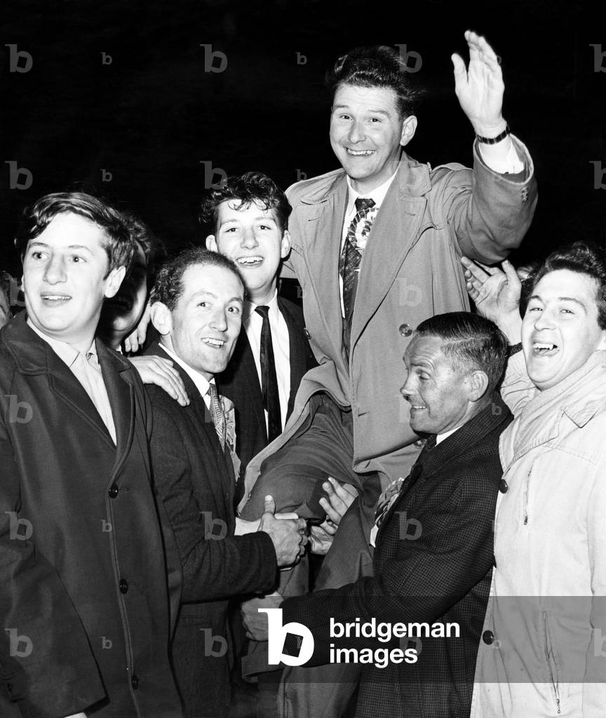 Cheering the winning candidate at Smethwick, Peter Griffiths, the Conservative who took away the seat from Labour's Patrick Gordon Walker. 15th October 1964 (b/w photo)