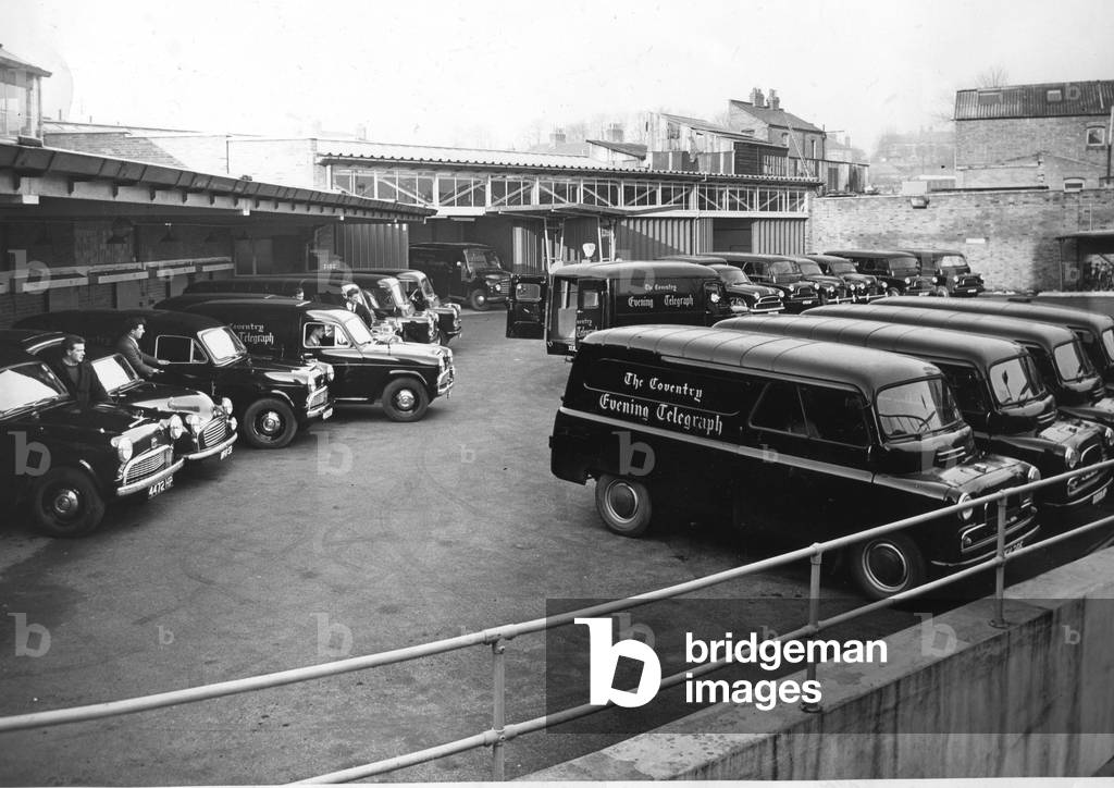 These vans made up the fleet belonging to the Coventry Evening Telegraph newspaper in the yard at the Corporation Street building, Coventry, c.1960.