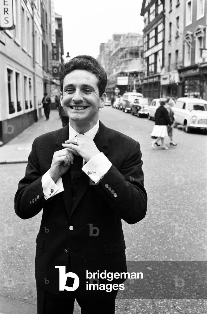 Skiffle King Lonnie Donegan, might sing about his old man being a dustman. But today experts decided that Lonnie himself was a very smart man. He has just been presented with an award for being one of Britain's ten best dressed men. The award was presented by the Wholesale Clothing Manufacturers Federation, Monday 4th July 1960 (b/w photo)