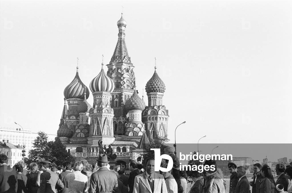 Crowds gather in front of The Cathedral of Vasily the Blessed, commonly known as Saint Basil's Cathedral, in Red Square in Moscow, Russia 17th October 1976 (b/w photo)