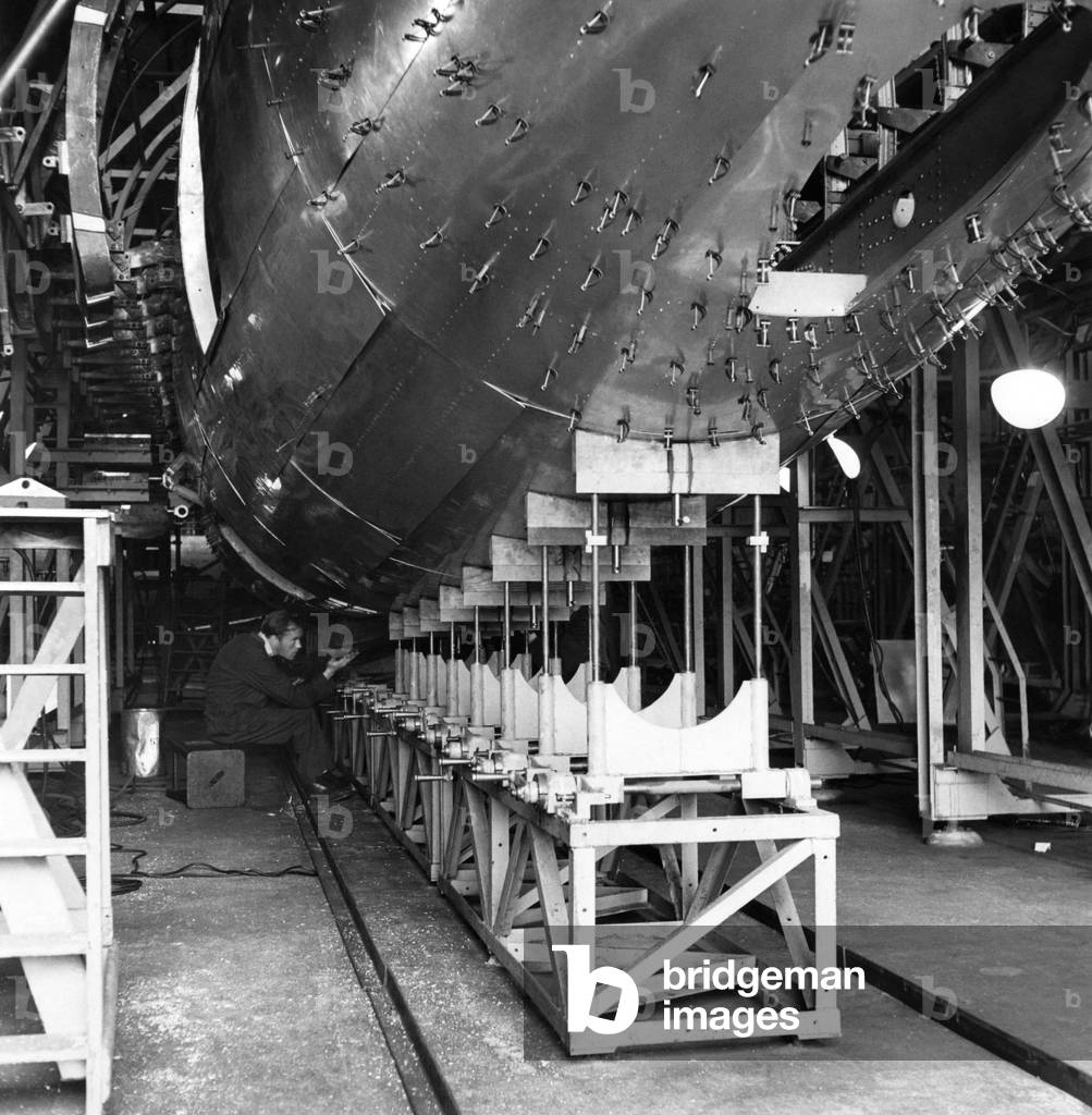 The Plane the King and Queen chose. A plane very much in production news, is the Vickers-Viking, chosen for the King and Queen to user during their South African tour. Viking fuselage nearing completion in the jig. February 1947