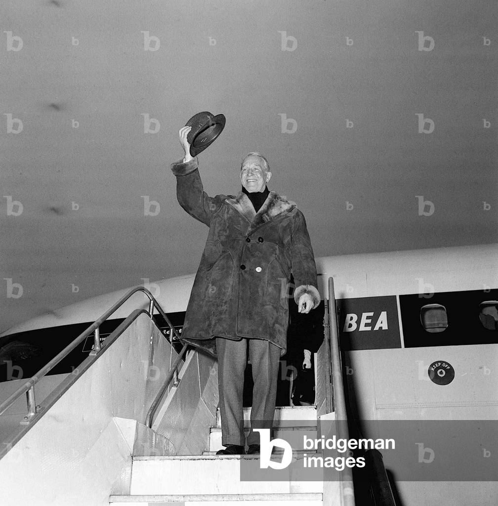 Maurice Chevalier Actor arriving at Heathrow from Amsterdam, for his final tour of Great Britain, February 1968 (b/w photo)
