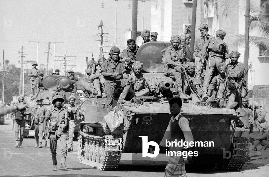 Elements of the victorious Indian army enter Kulna following the surrender of the Pakistan army Our Picture Shows: Soldiers celebrating the peace on a T55 Russian built tank, 20/12/1971 (b/w photo)