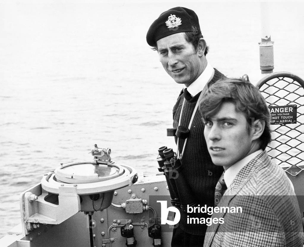 Prince Charles, The Prince of Wales on board HMS Bronington showing his younger brother Prince Andrew around the coastal minesweeper, during a voyage off the coast of Scotland, c. 01/10/1976