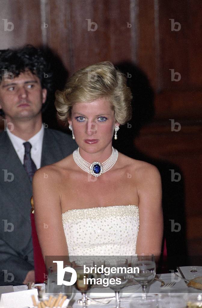 Princess Diana looking serious during an overseas visit to Hungary in May 1990. Wearing a sapphire choker.