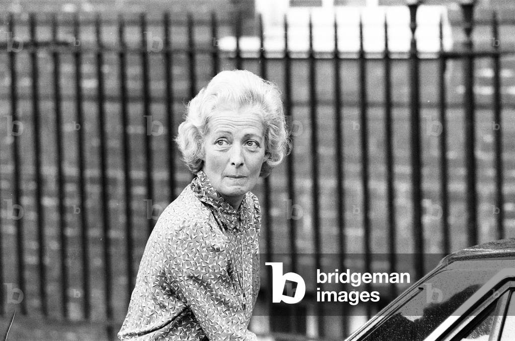 Frances Shand Kydd, proud mother of Princess Diana, Princess of Wales, leaves St Mary's Hospital, London after visiting her daughter and new grandson, Prince William, pictured with Lady Jane Fellowes, Diana's sister, Wednesday 22nd June 1982 (b/w photo)