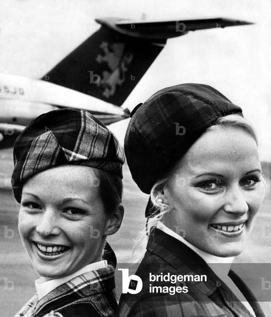British Caledonian Airways sales staff, Pat Neill (left) and Gilly Penny. Pat, 23, and Gilly, 24, were part of a six strong sales force meeting travel agents and top industry and commerce businessmen on Tyneside and Teesside. They were publicising the Dan-Air Newcastle-Gatwick service which was about to begin as British Caledonian's inter-continental flights leave from London's second airport, 20/04/1974 (b/w photo)