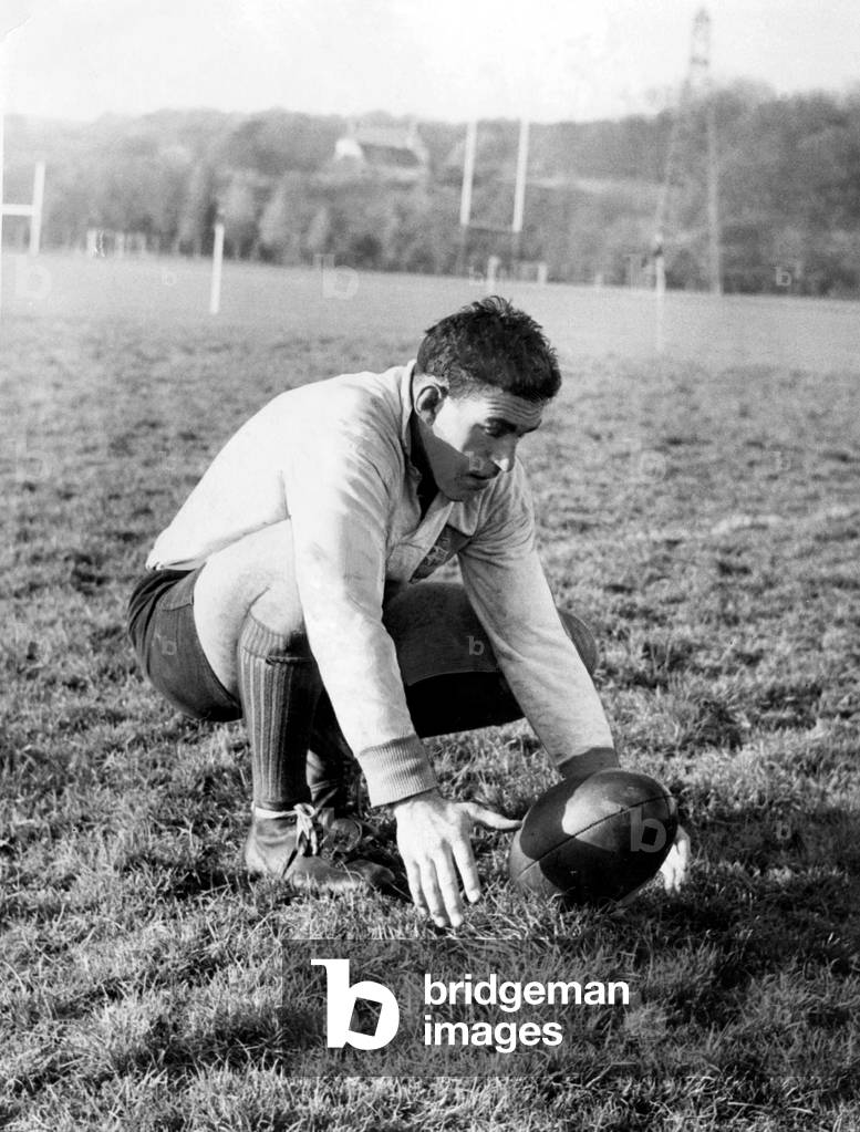 Colin Meads, New Zealand rugby player practising place kicking during a All Blacks training session at the College ground, Llanrumney, Cardiff - 4th Dec 1967