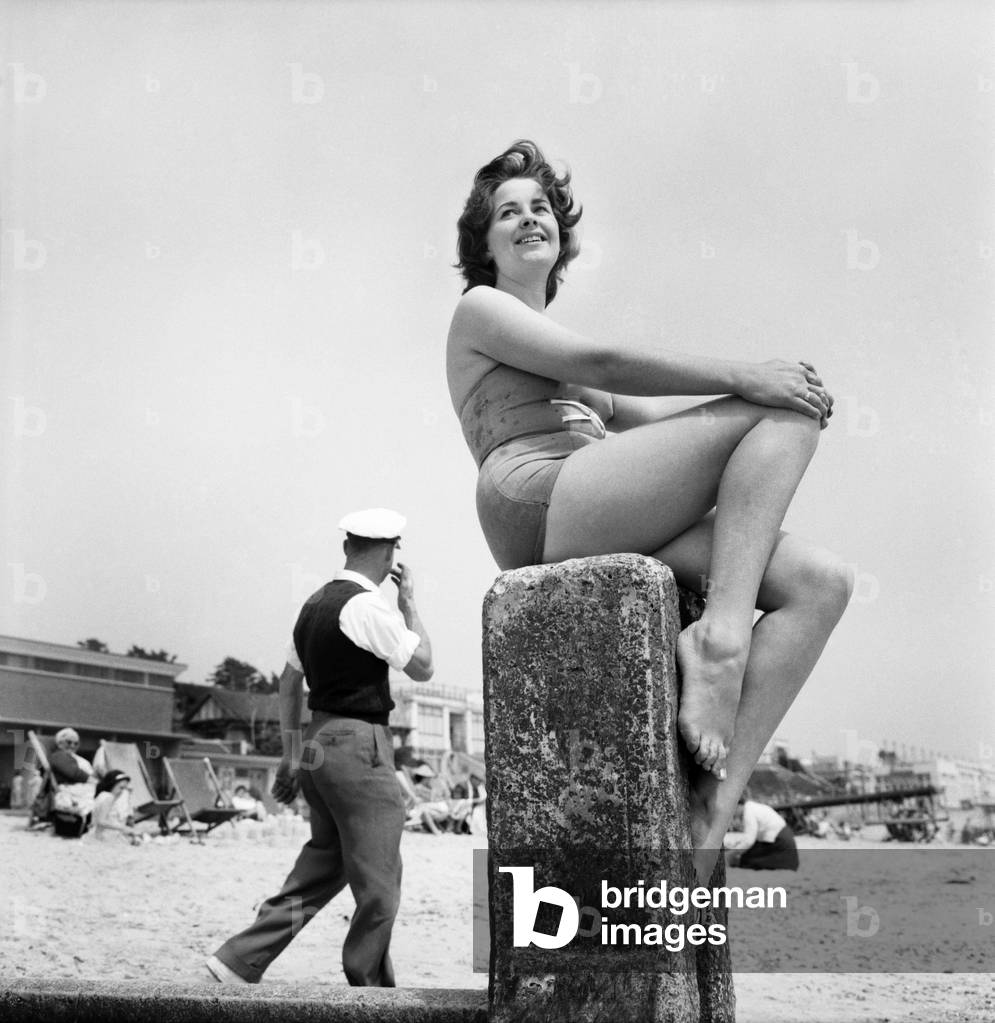 Bathing Girl: Glamour on the Clacton Beach: Who will go rowing with Christine Reynolds glamour girl. June 1960