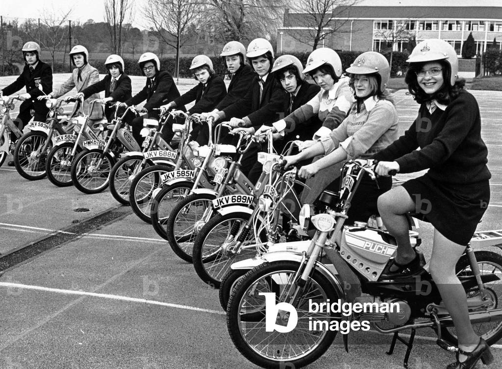 Twelve Warwickshire schools receive a moped for their respective schools as part of a road safety scheme called STEP - Schools Traffic Education Programme. It is designed to give pupils practical and theoretical instruction about road usage, particularly riding mopeds and light motor cycles. 14th April 1975 (b/w photo)