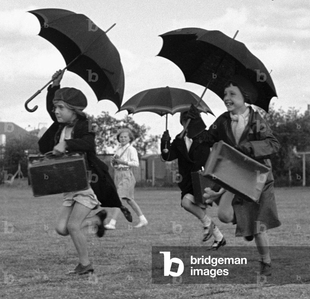The umbrella race during a schools sports day in Kingston Upon Thames. Circa 1936