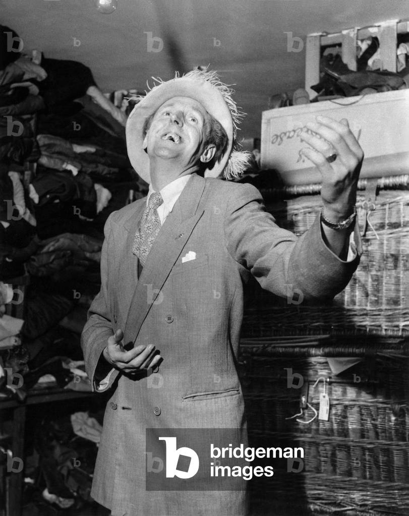 Cardew Robinson a British comic, whose craft was rooted in the music hall and Gang Shows seen here performing, May 1956 (b/w photo)