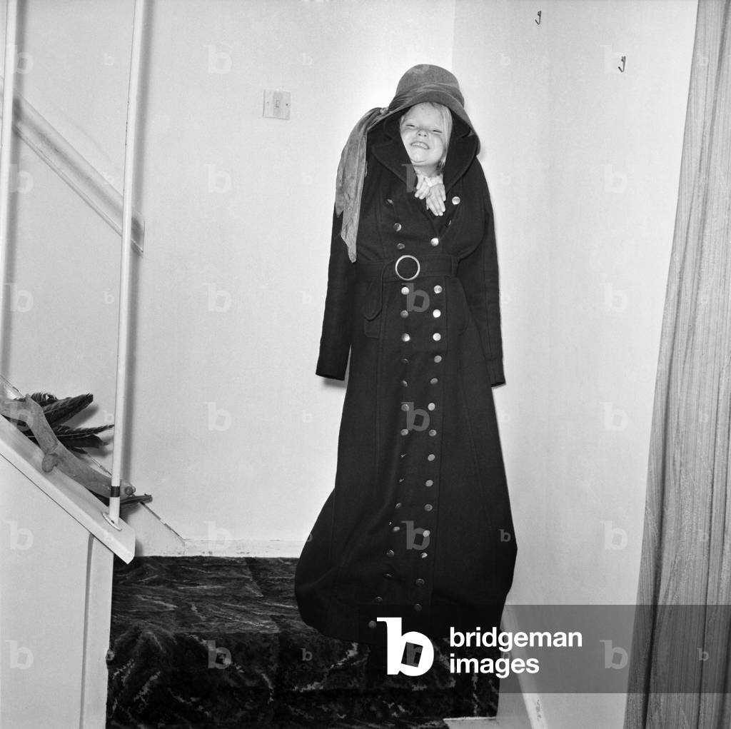 Clothing fashion. Model Ann Coates wearing a maxi coat. December 1969