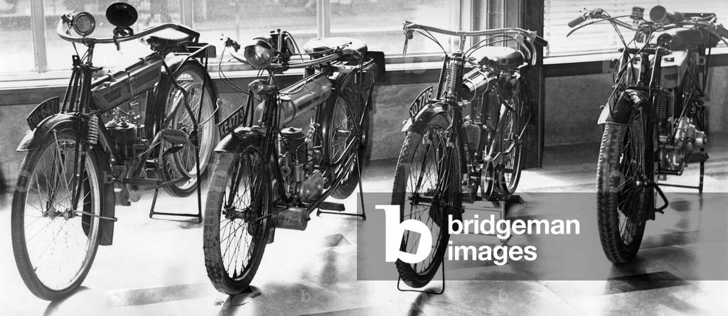 These four motor cycles are on display at the newly-opened Herbert Art Gallery and Museum in Coventry. The newly-restored machines are from left: A 1912 Premier, a 1919 Triumph, a Wee MacGregor made in Coventry in 1923 and a 1927 Triumph. 18th March 1960 (b/w photo)