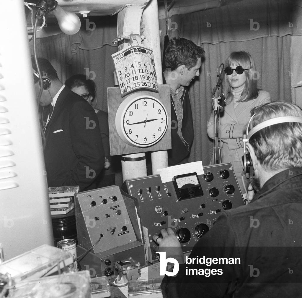 Marianne Faithfull pictured with members of Radio London pictured on the Pirate Radio Ship. 8th May 1965 (b/w photo)