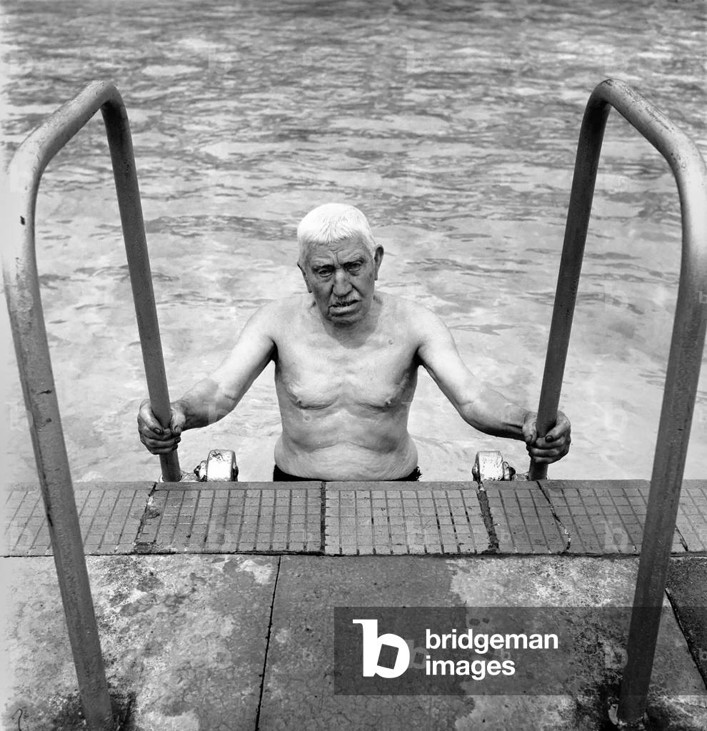 William Johnson 90 year old swimmer seen here taking exercise at his local pool, July 1958 (b/w photo)