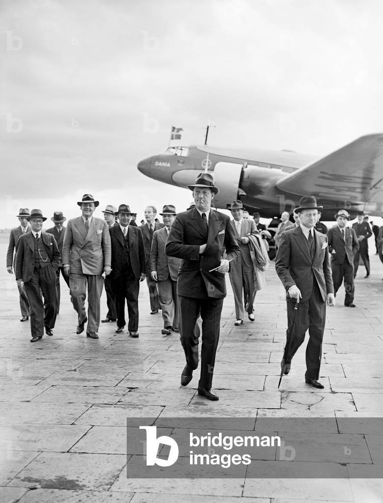 Prince Axel of Denmark on a official visit dis-embarks from Danish Air Lines' Focke-Wulf Fw 200A-0 Condor OY-DAM Dania seen here at Croydon on 28th July 1938 (b/w photo)