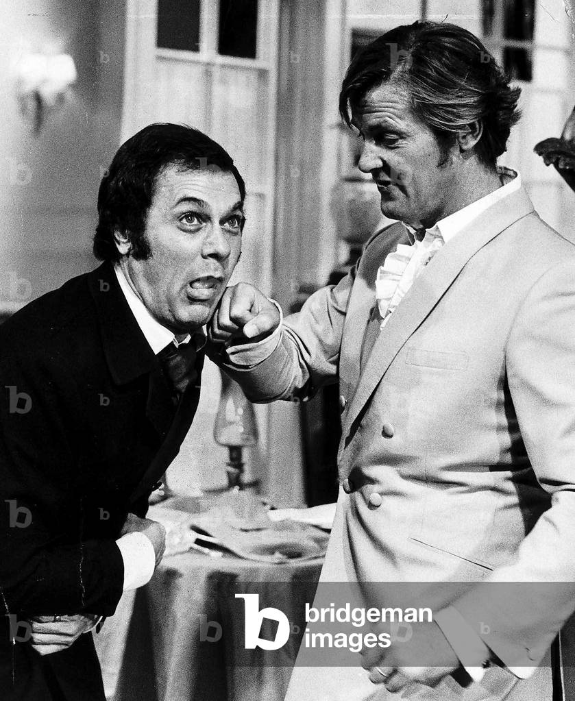 Tony Curtis and Roger Moore ham it up on the set of the Television series THE PERSUADERS at Pinewood Film Studios, 11th August 1970 (b/w photo)