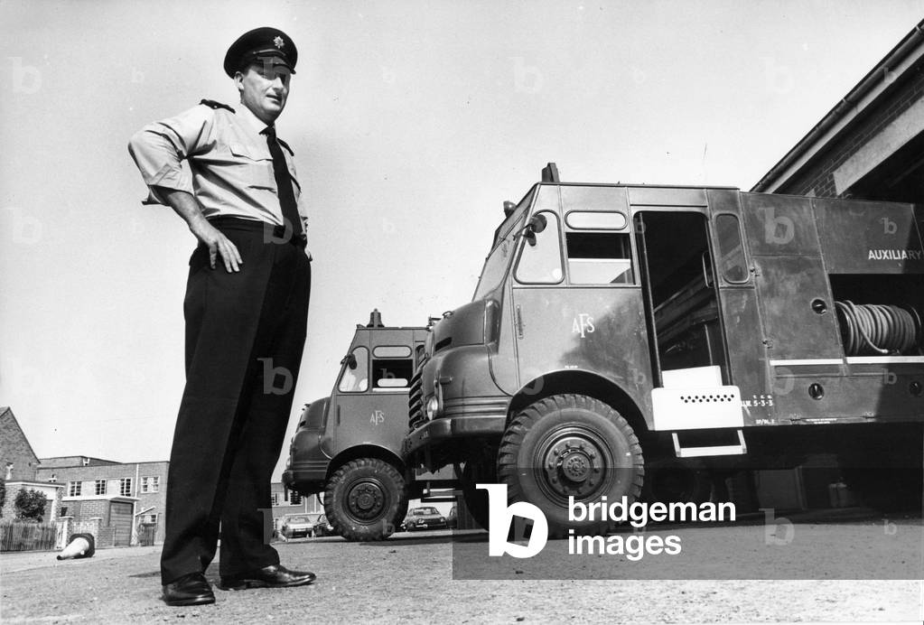 Fireman Jim Cairns with two of the fire appliances brought out of storage to help fight the increasing numbers of fires in the Durham area, c.1970