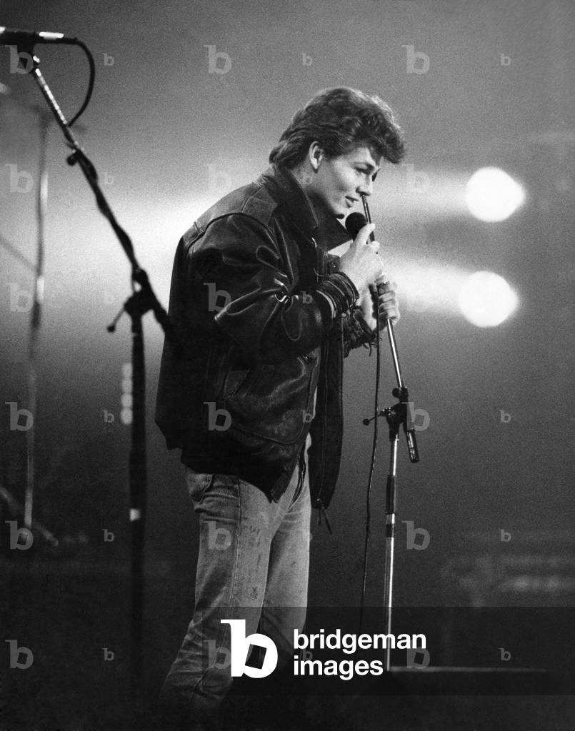 Morten Harket, lead singer of the Norwegian pop group A-ha, performing live on stage. 
December 1986